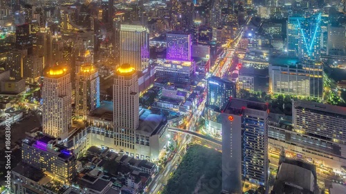 Aerial Night Timelapse of Ratchaprasong Intersection, Bangkok with Heavy Traffic.