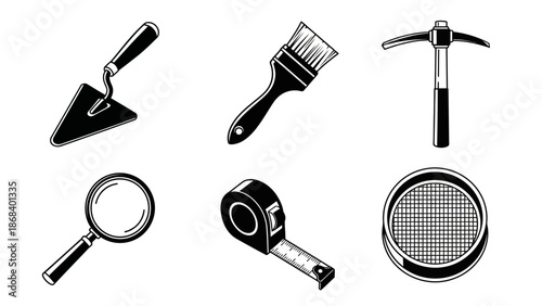 Set of various hand tools silhouetted in black and white isolated on white