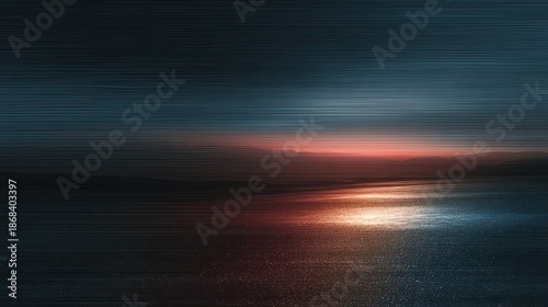 Blurry sunset over dark water, streaks of light