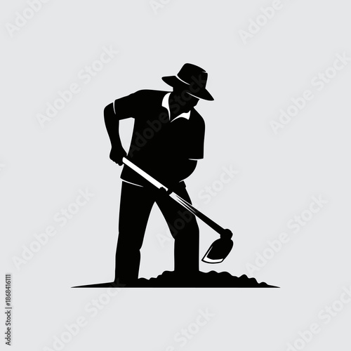 Farmer silhouette working with a hoe in the field on a gray background