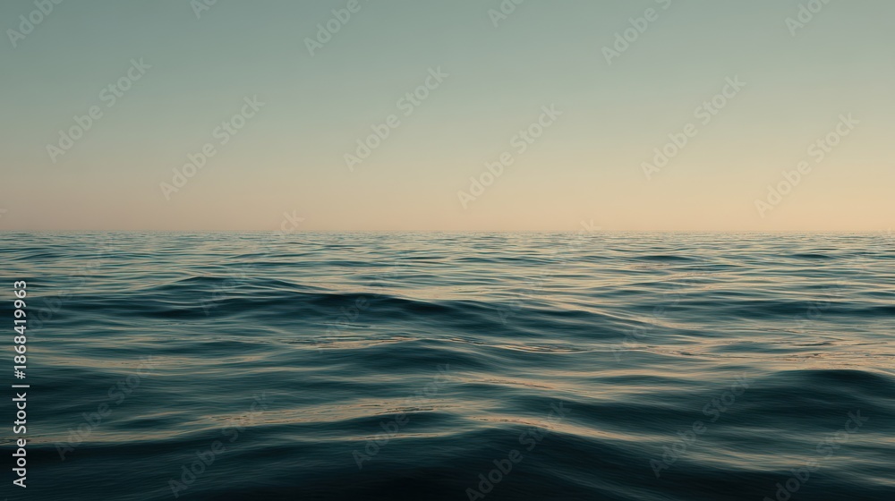 Obraz premium Calm Ocean Waves Under Soft Light at Dusk for Tranquil Scenes