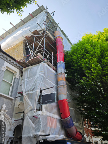 Europe, UK, England, london, scaffolding tin hat on house roof renovation