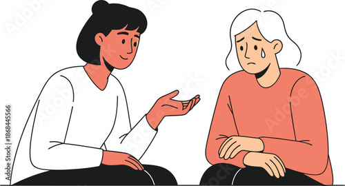 Two women sitting and talking to each other with one looking sad and upset