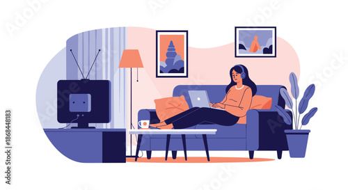Young woman sitting on a comfortable blue couch wearing headphones and using a laptop in a cozy room.