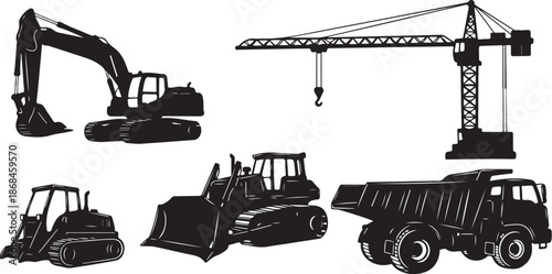 Construction vehicles and equipment in silhouette