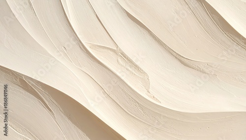 Beige plaster abstract texture with flowing sculpted waves and warm tones