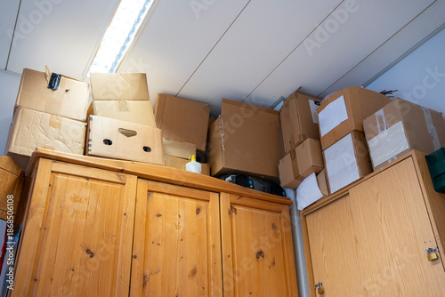 фотографія Old archive room with cabinet and stacked cardboard boxes in abandoned office