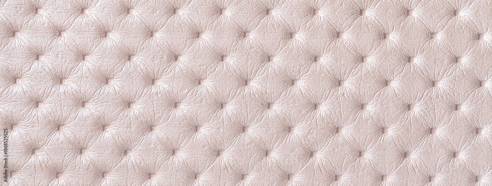 Fototapeta premium Pastel beige leather texture with capitone pattern, macro background of cream retro Chesterfield vintage textile fabric