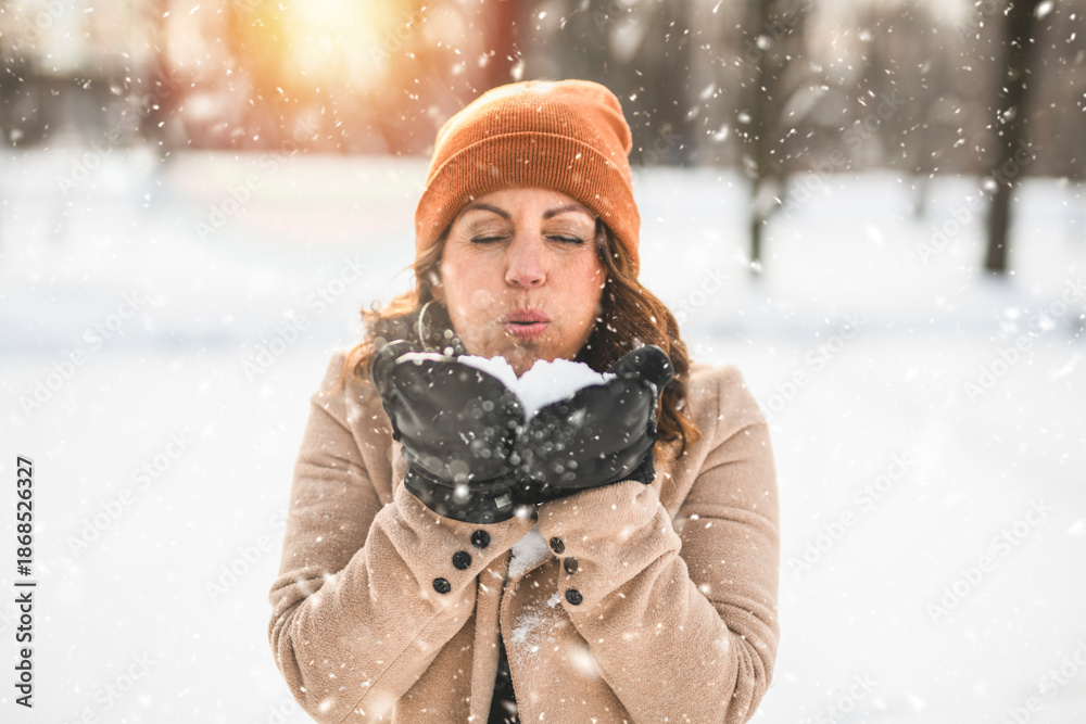 Fototapeta premium Portrait of mature woman in winter park
