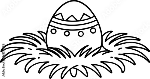 Decorative easter egg nestled in grass with patterned design and ornamental details