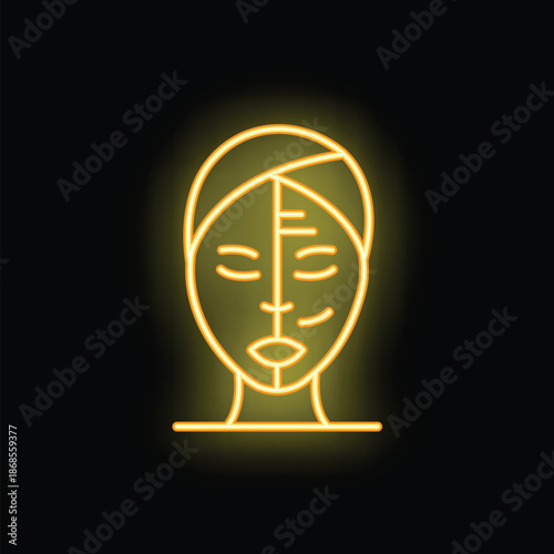 Yellow neon sign illustrating a woman with closed eyes getting a facial treatment