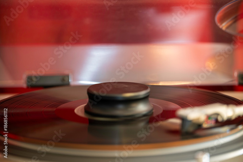 8K photo of record spinning on turn table. Motion of the turntable. Vintage vinyl player.