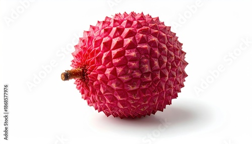 Close-up of a single ripe lychee fruit with textured red skin.