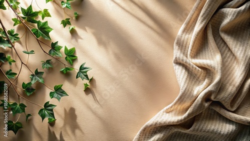 Wallpaper Mural Sunlight Illuminates Lush Greenery Beside a Soft, Textured Fabric Drape on a Neutral Background Torontodigital.ca