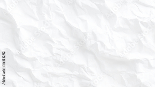 A close up view of a heavily wrinkled and textured white paper surface