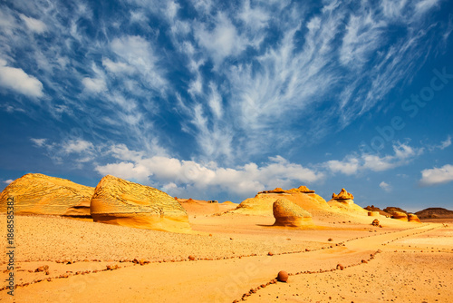 Sand and rock desert landscape with the path, Wadi Hitan, Egypt