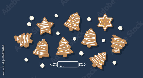 Collection of decorated gingerbread cookies in festive shapes like trees and stars, with a rolling pin on a dark blue background.