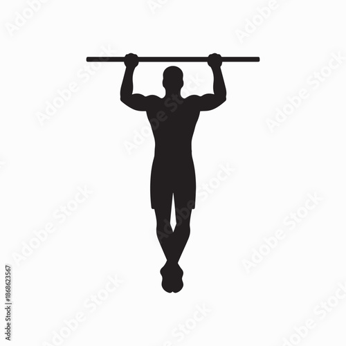 Silhouette of Muscular Man Doing Pull-Up Exercise on Dark Background