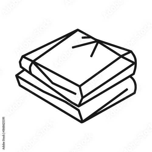 Stack of clean folded towels with ribbon