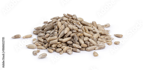Heap of healthy peeled sunflower kernels, ready for consumption. Isolated on white background.
