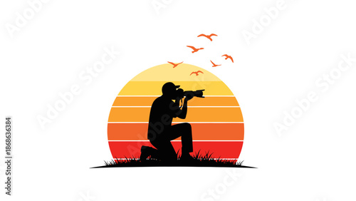 Silhouette of a photographer kneeling and aiming camera at sunset.