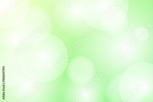 光と丸いぼかしが重なる淡い緑の幻想的な抽象背景イラスト