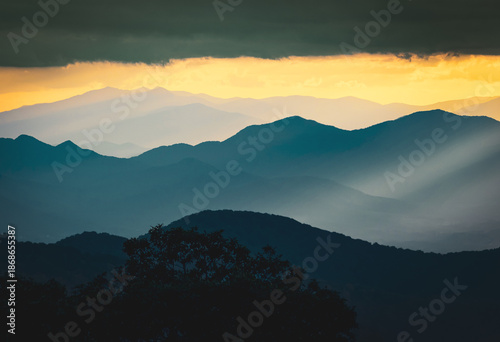 Картината върху платно Cloudy sunset palette of shades of brown, orange and gold viewed from the Craggy