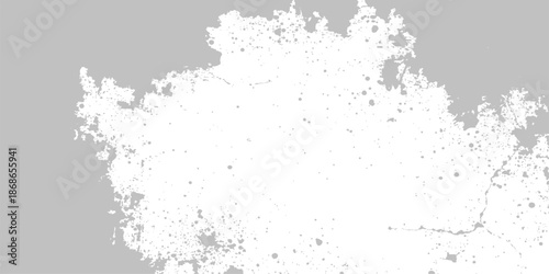 An abstract grunge background featuring black ink splats and artistic splashes on a textured dark wall with a dusty paint effect and a dirty vector border pattern