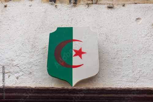 Algerian flag shield on the wall.