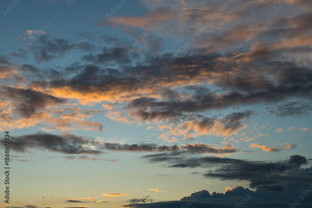 Fototapeta premium Black and yellow clouds. Beautiful sunset sky