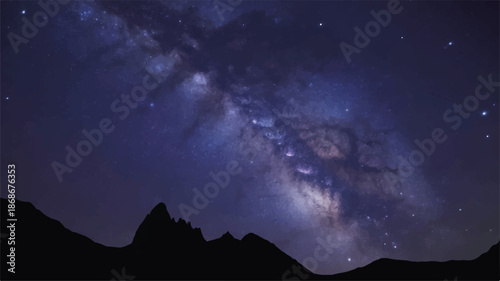 A night sky filled with stars and a bright Milky Way over dark mountains. 