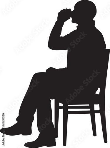 Silhouette of a person sitting on a chair with hands near face
