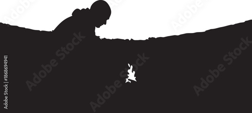 Silhouette of a person whispering to a white rabbit in a dark landscape