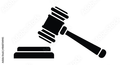A striking black silhouette of a gavel resting on a sound block symbolizing legal authority silhouette