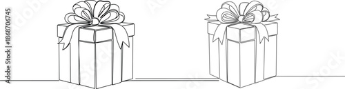 Two beautifully wrapped gift boxes with ribbon bows, perfect for celebrations and special occasions