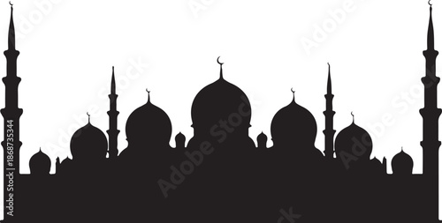 Mosque silhouette at dusk with minarets and domes