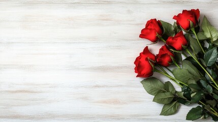 Delicate arrangement of red roses and heart shapes on a white wooden table, perfect for Valentine's Day with ample space for custom text