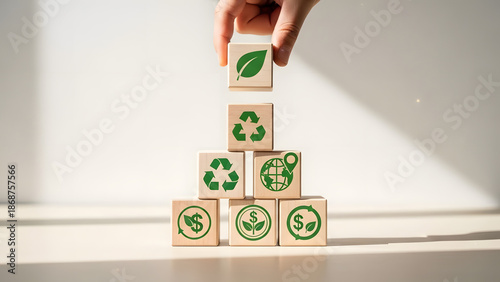 Concept of ecological sustainability and green economy with environmental icons on blocks