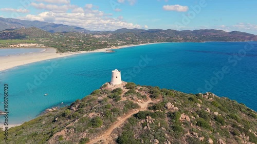 scenic view of historic tower and coast, panoramic image of old tower overlooking turquoise waters