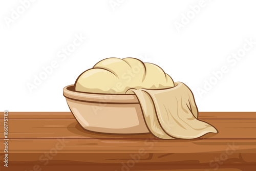 A bowl of dough sits on a wooden table with a cloth draped over it.