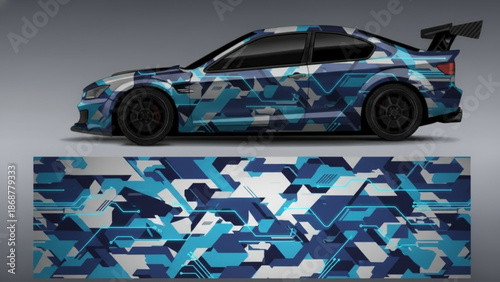 A sports car with a blue and white geometric camouflage wrap design, showcasing the full pattern below.