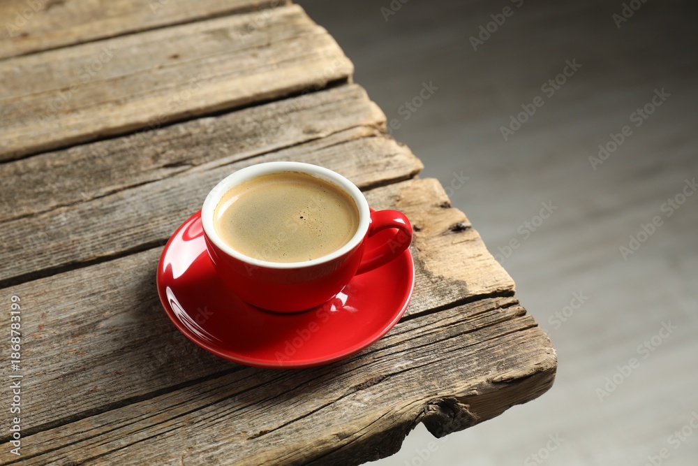 Obraz premium Cup of aromatic coffee on wooden table indoors. Space for text