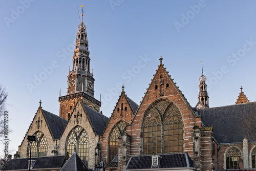 Canvas Print Low angle view of the Oude Kerk (Old Church) tower and gothic brick facade again