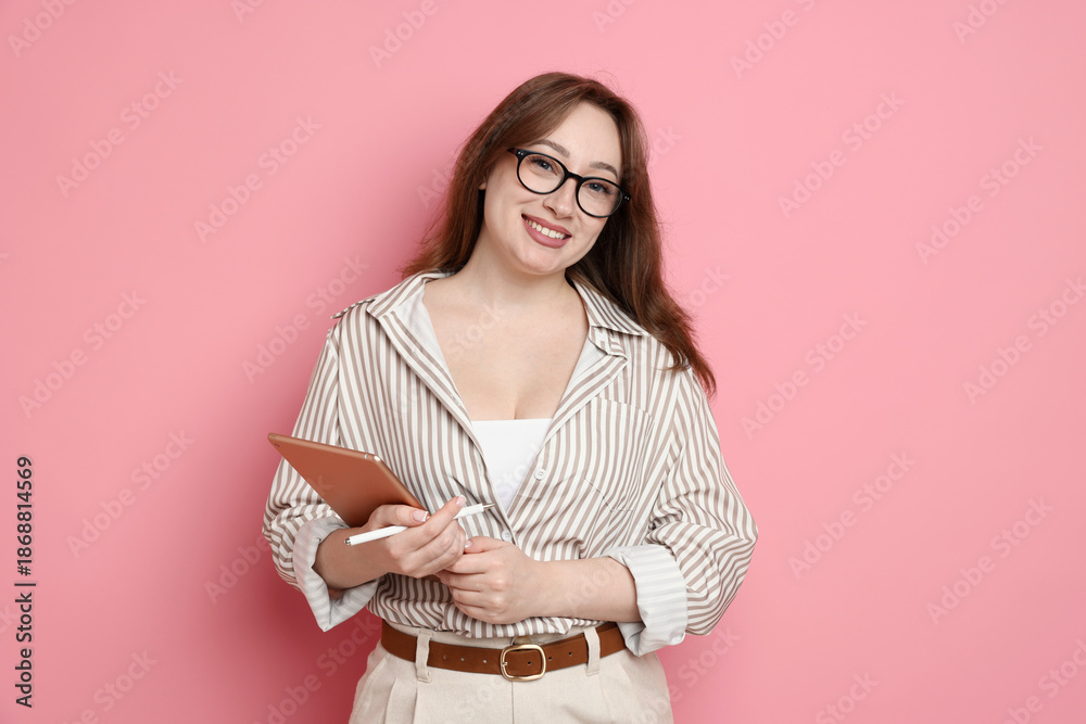 Obraz premium Professional designer with tablet on pink background