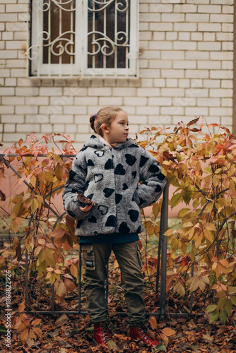 little girl in autumn park