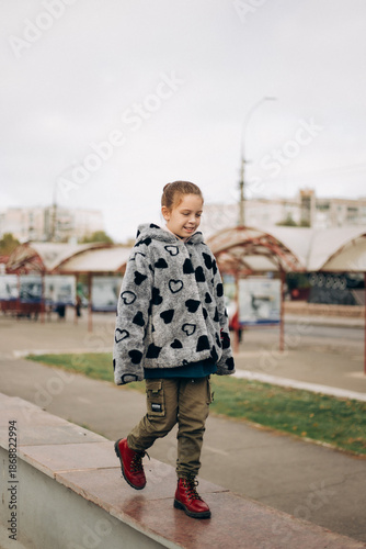 little girl walking on the street