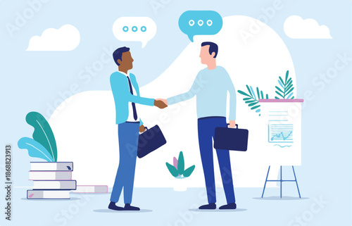 Casual business people shaking hands over deal - Two men in office doing handshake while talking. Agreement and cooperation concept