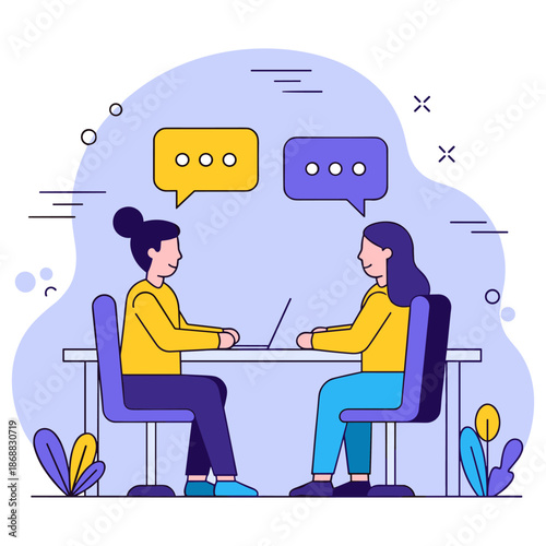 Two young caucasian females engaged in conversation at a desk with laptops