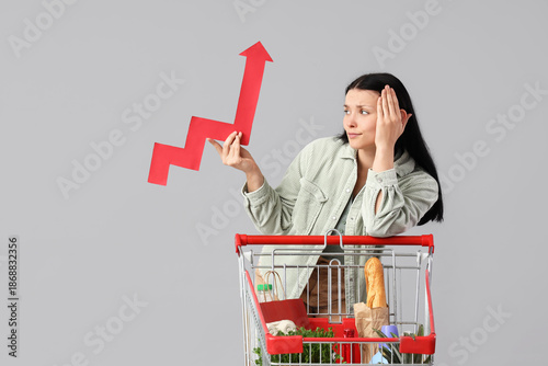 Upset young woman with shop...