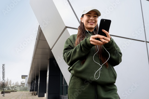 Young woman in khaki sports...